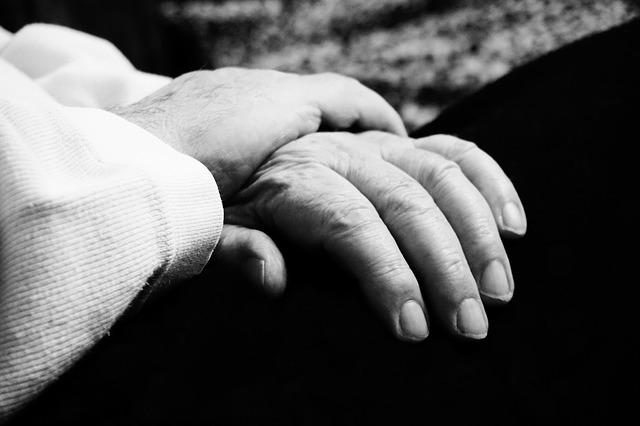 close up photo of an older person's hands in their lap